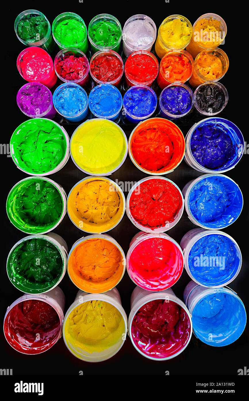 several colors plastisol ink cans in factory who use plastisol ink