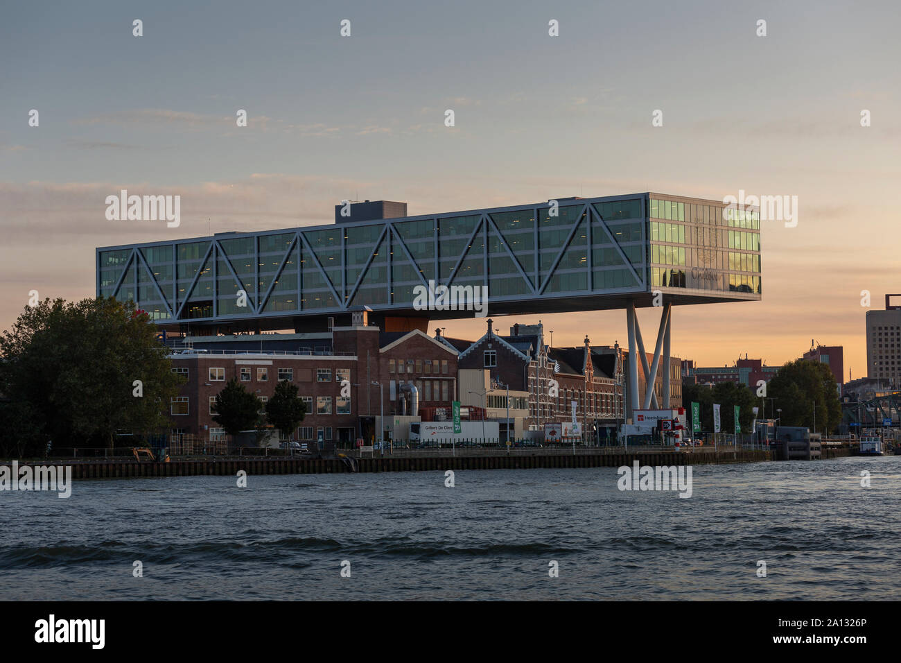 Unilever modern office building build over former traditional homes and offices with the modern city in the background at golden hour sunset Stock Photo