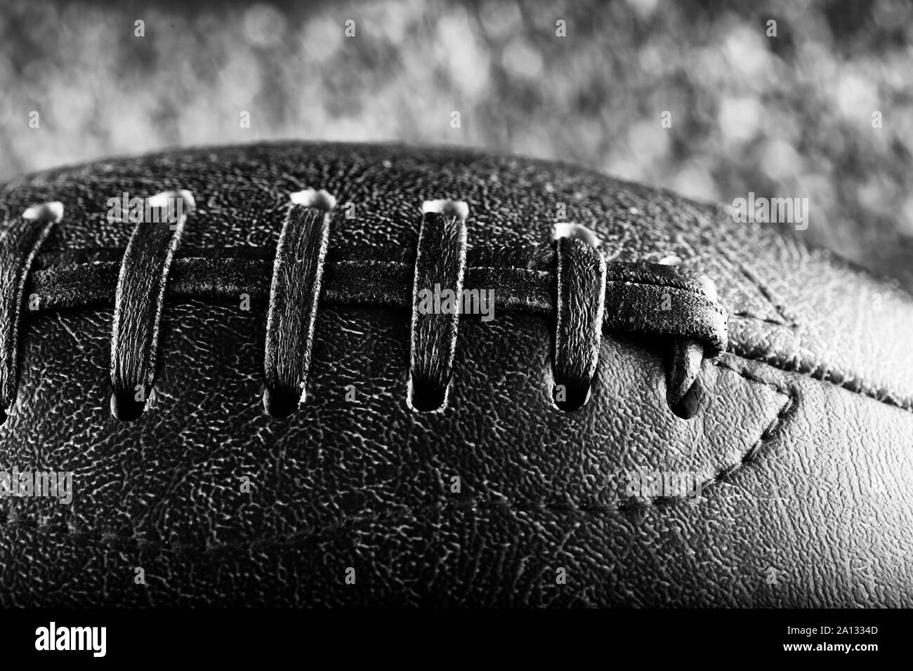 Leather football in close up, black and white horizontal image Stock