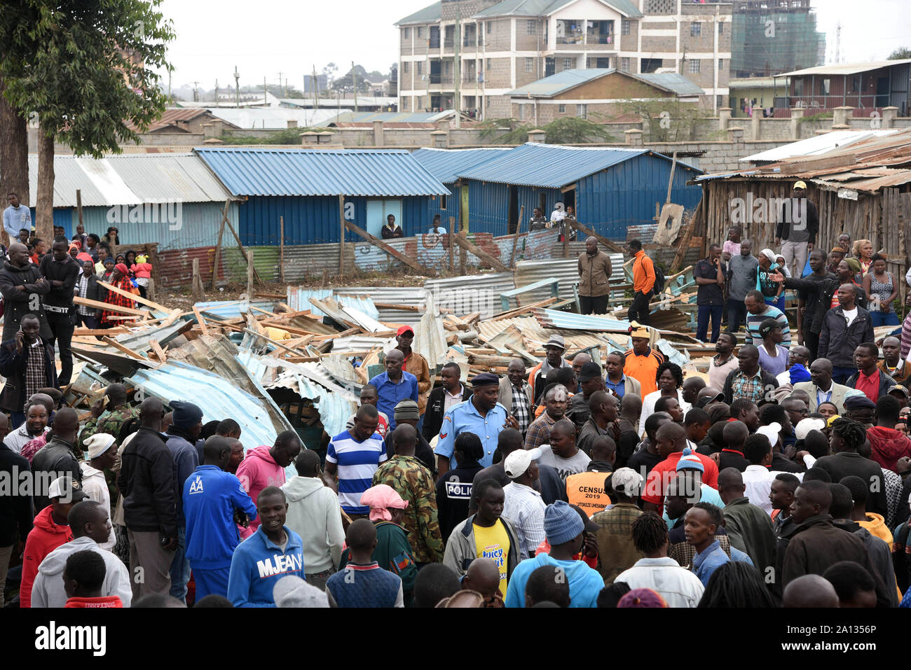 Nairobi, Kenya. 23rd Sep, 2019. People stand at the scene where a classroom collapsed in Nairobi, capital of Kenya, on Sept. 23, 2019. At least seven pupils were killed and 59 others injured early Monday after their classroom collapsed at a school compound in Nairobi, government and charity officials said. Credit: John Okoyo/Xinhua Credit: Xinhua/Alamy Live News Stock Photo