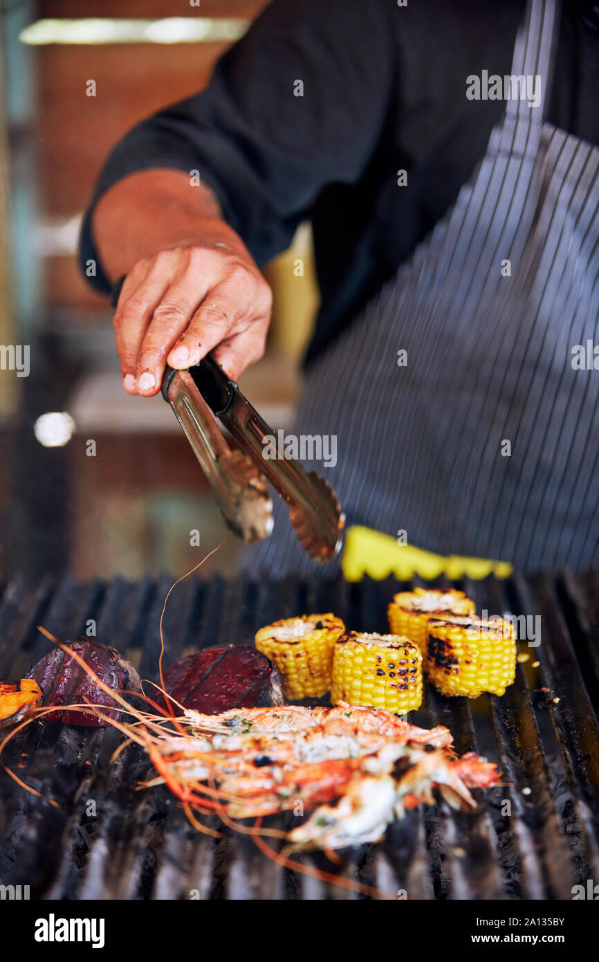 Grilling fresh locally sourced seafood and vegetables Stock Photo