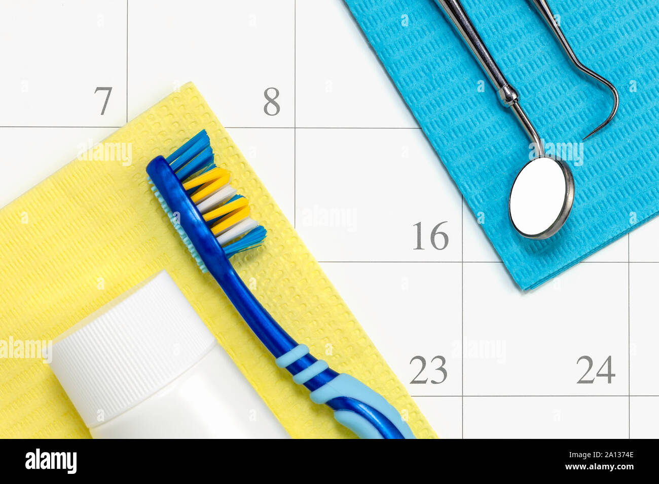Dentist appointment and dental check up health care concept reminder in month calendar with toothbrush dental tools and toothpaste. Stock Photo