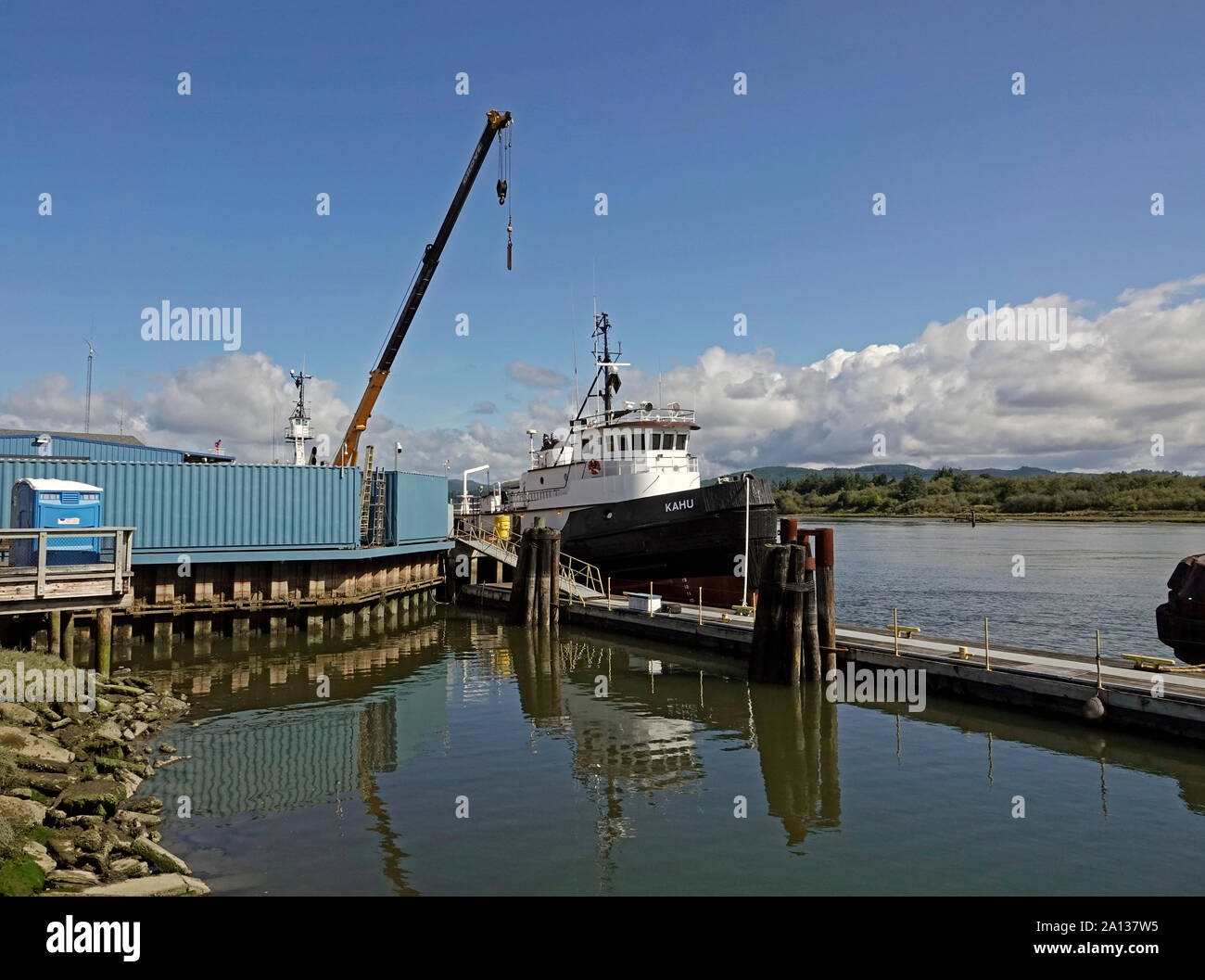 A large river tug tied up at a dock in Coos Bay, Oregon. Stock Photo