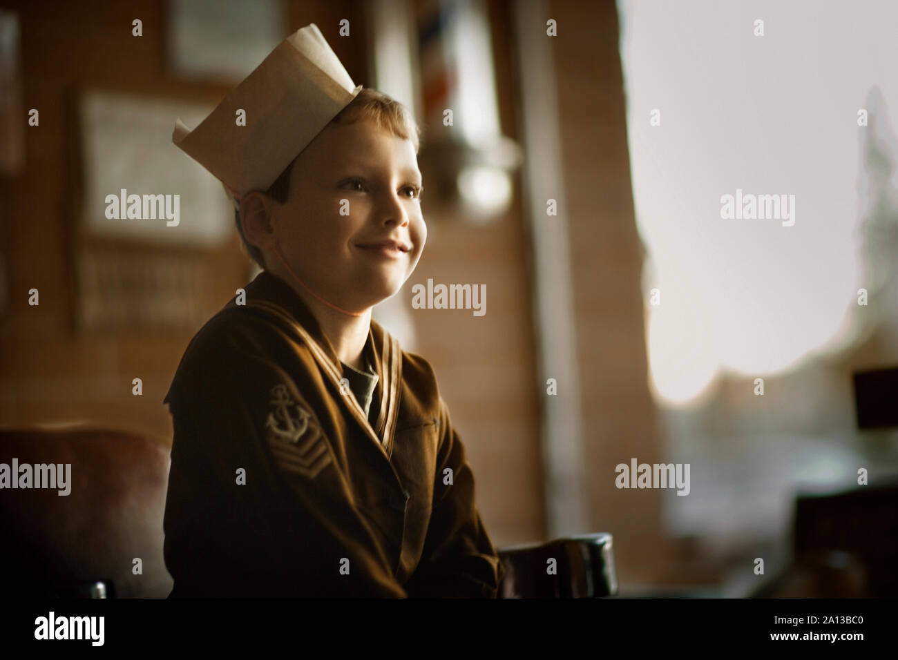 Side view of a schoolchild smiling. Stock Photo