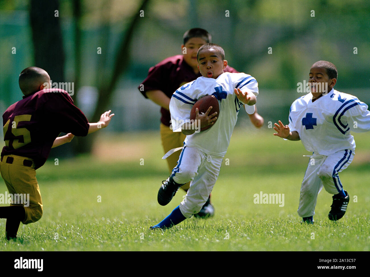 Young boys playing American Football Stock Photo Alamy