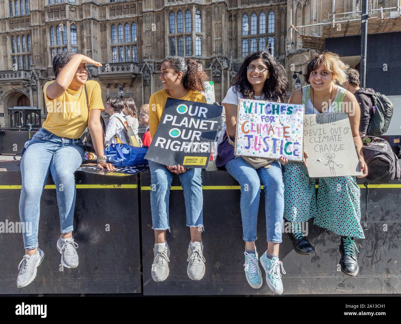 London / UK - September 20th 2019 - Young female climate change activist hold signs while demonstrating in Westminster at the Climate Strike Stock Photo