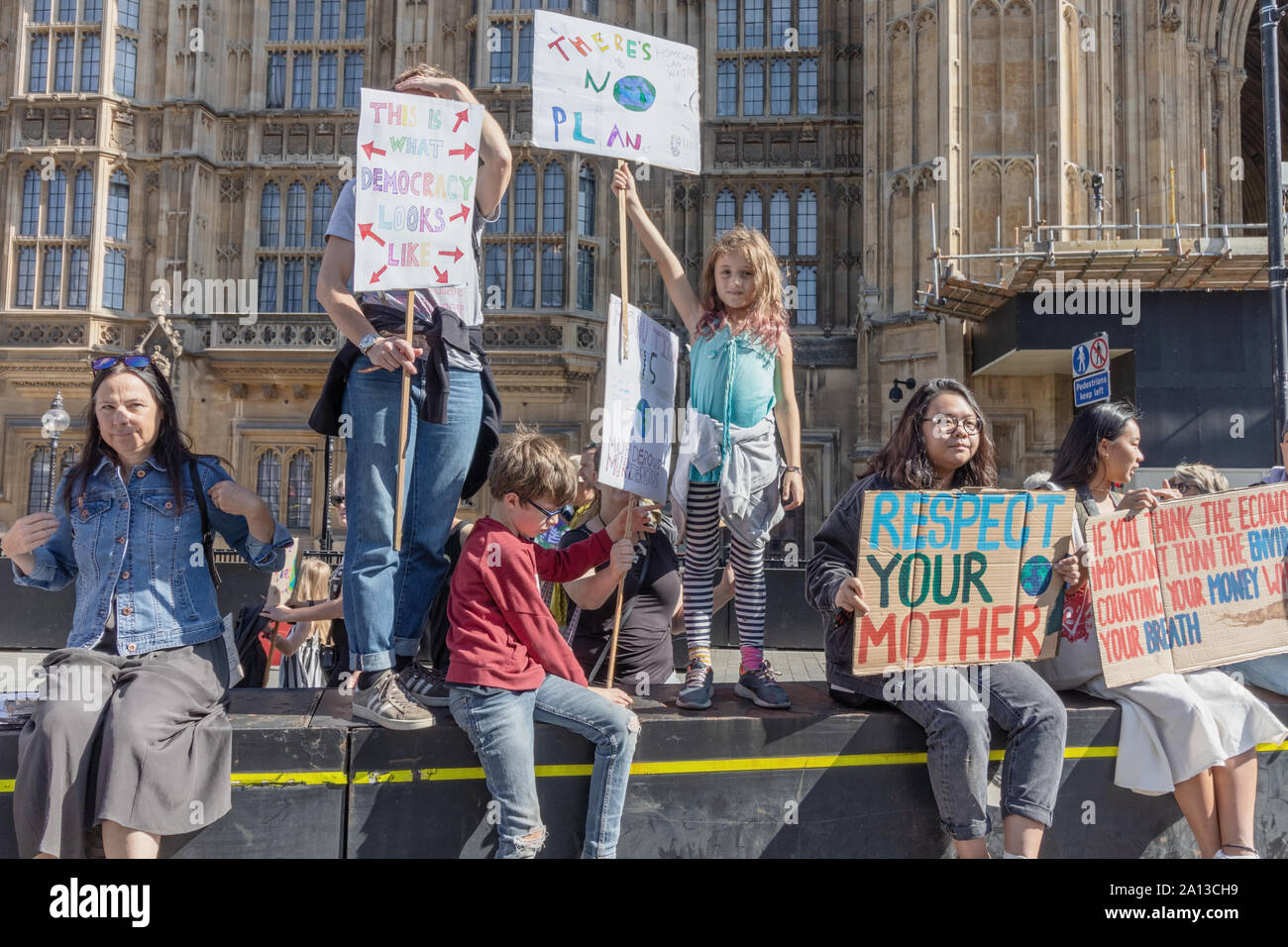 London / UK - September 20th 2019 - Young climate change activists hold signs at the Climate Strike event in Westminster Stock Photo