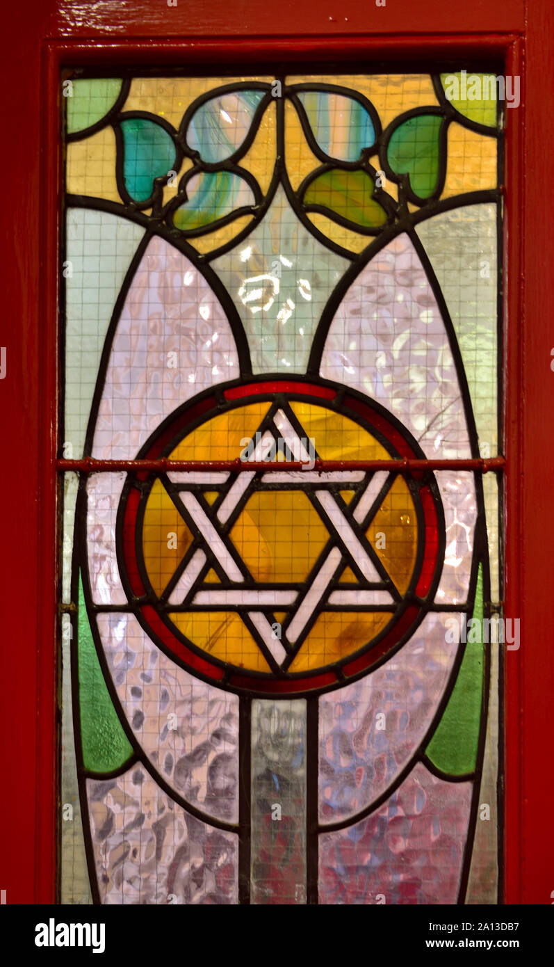 Art Nouveau stained glass window with Star of David in Synagogue door Stock Photo