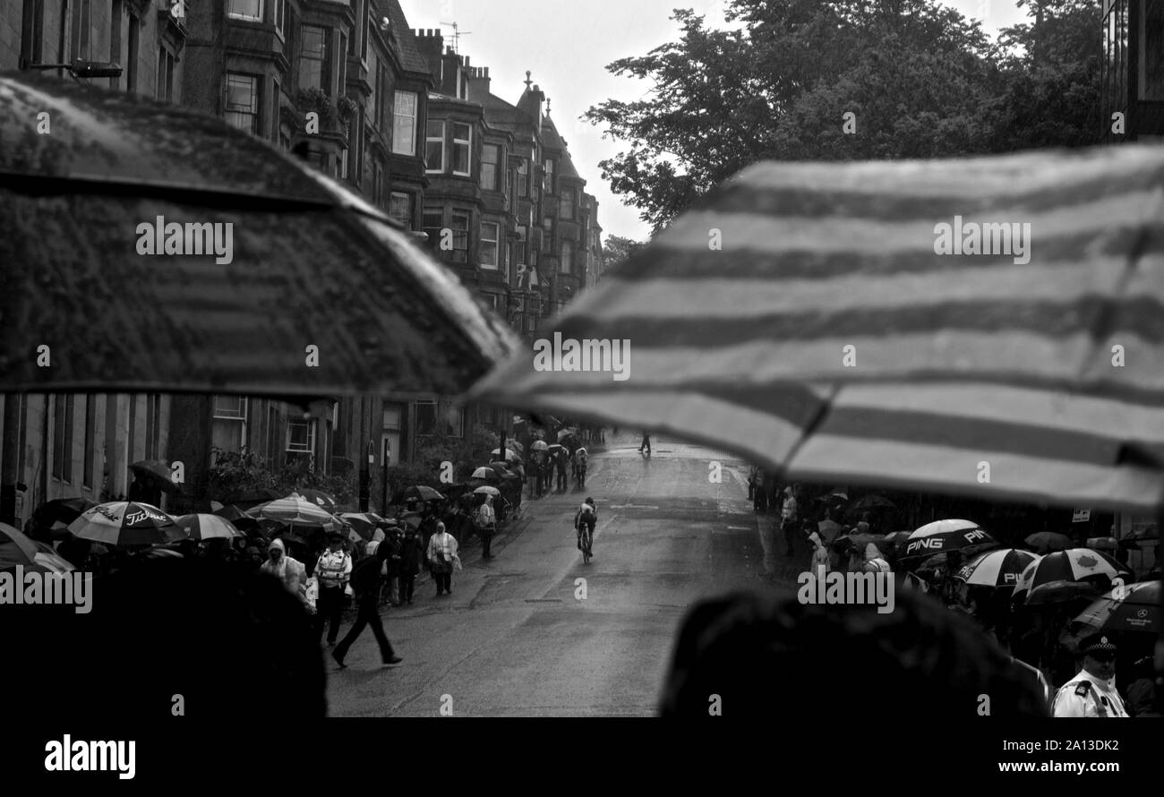 Umbrellas from sporting crowd in Glasgow rain, at Commonwealth Games bike/cycle race. Glasgow, 2014 Stock Photo