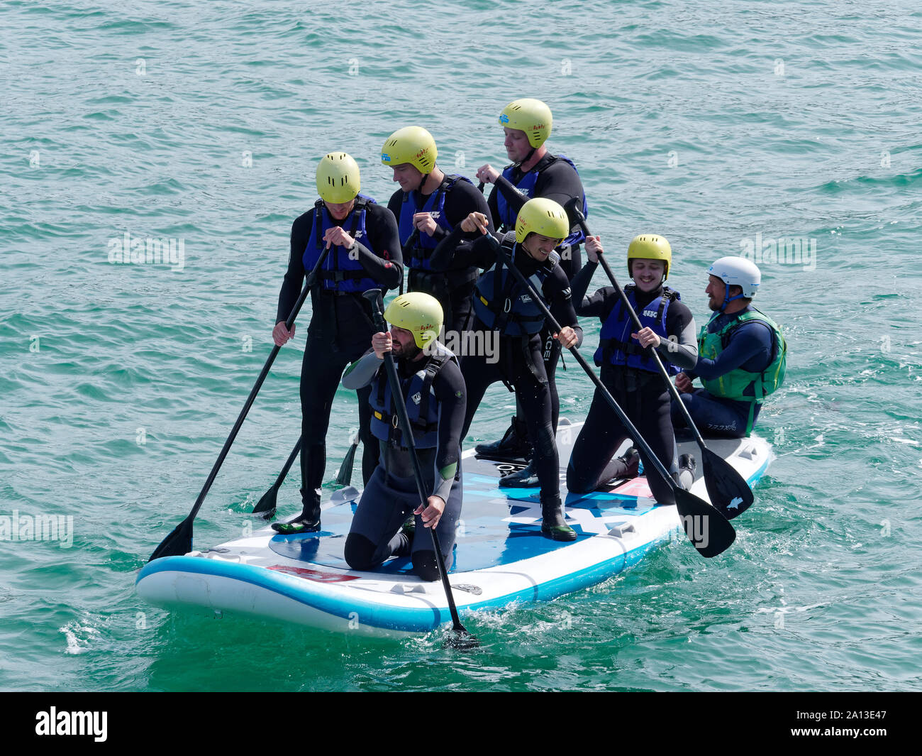 Women rowing in teams of six in traditional hand built pilot gig boats