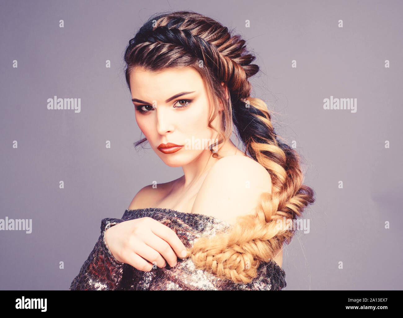Beauty salon hairdresser art. Girl makeup face braided long hair. French  braid. Professional hair care and creating hairstyle. Braided hairstyle.  Beautiful young woman with modern hairstyle Stock Photo - Alamy