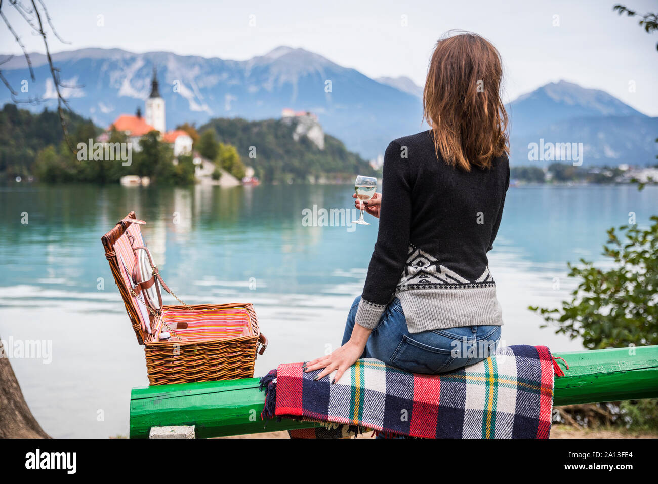 Woman park bench alone rear view hi-res stock photography and images ...