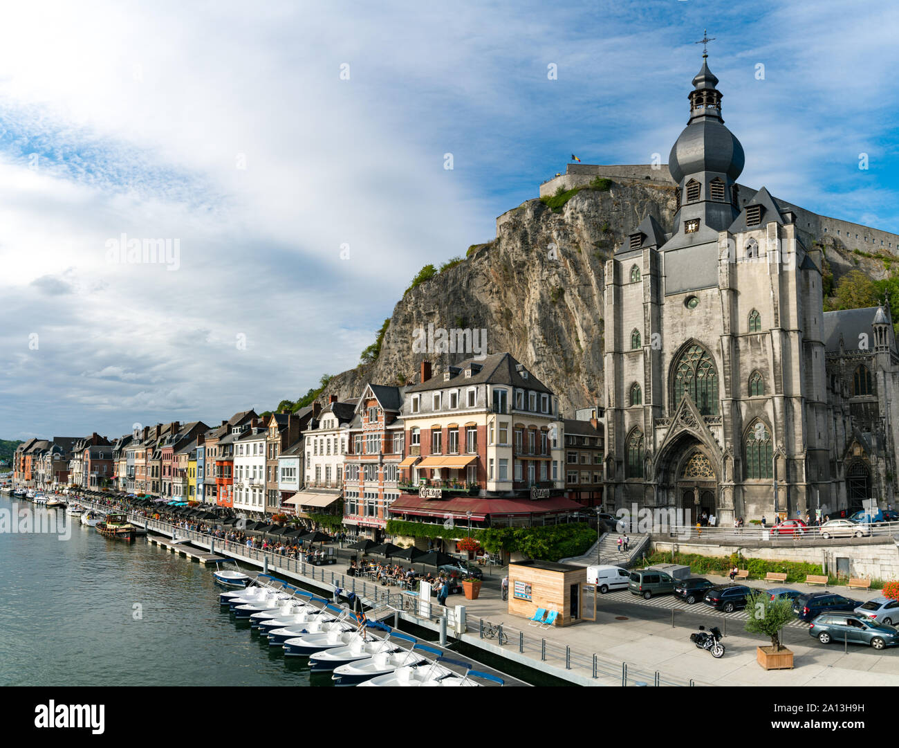 Dinant, Namur / Belgium - 11 August 2019: horizontal view of the Meuse River and the historic old riverside town of Dinant in Belgium Stock Photo