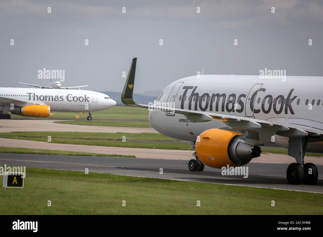 (File image) Thomas Cook civil jet airliners captured at Manchester International Airport, Great Britain. As reported on Monday, 23 Sep 2019, Thomas Cook Group Plc, the 178-year travel company that became one of the U.K.’s best-known brands, has collapsed under a pile of debt, leaving tens of thousands of British tourists stranded across Europe. Stock Photo