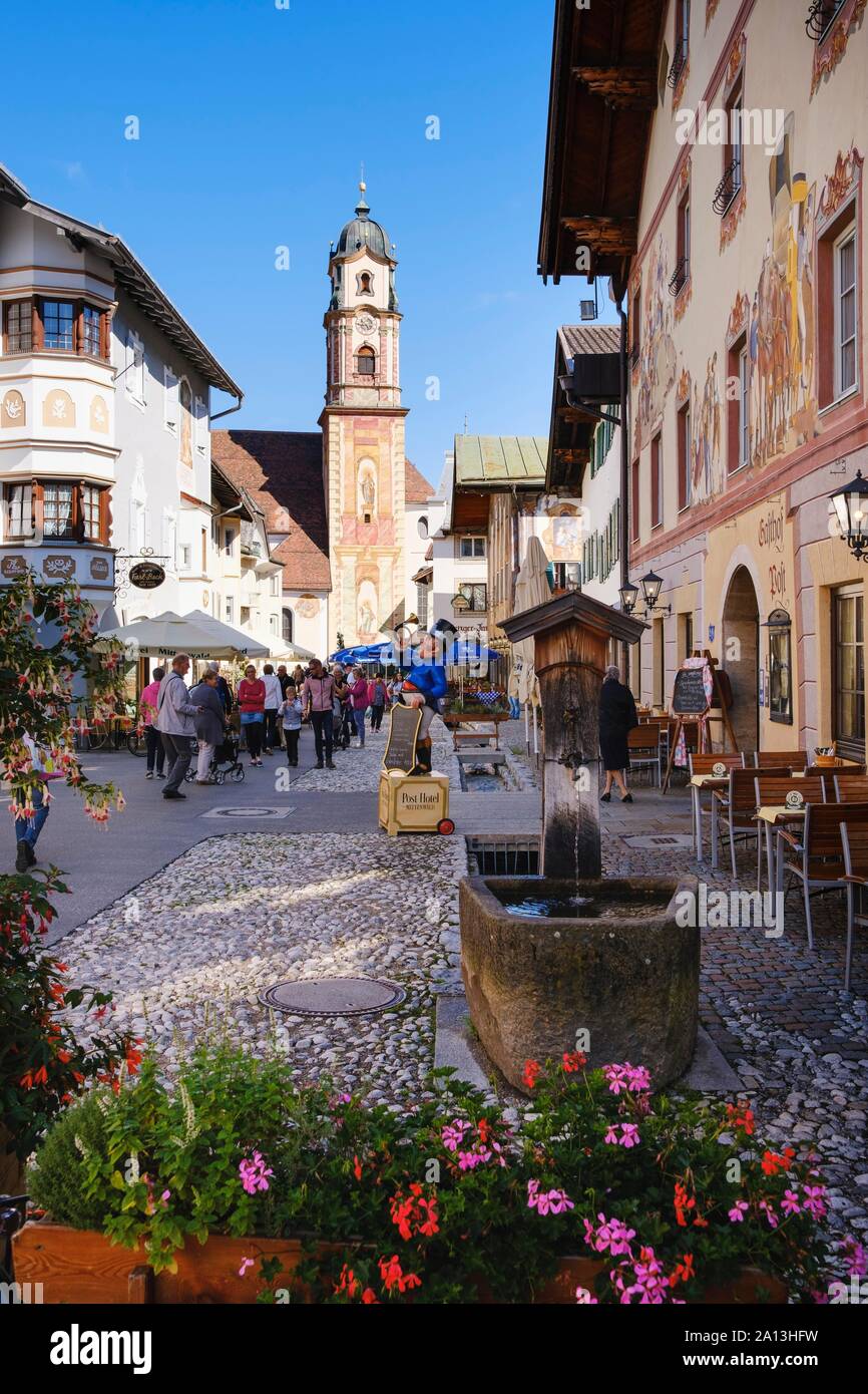 Historic houses in the town centre with church St. Peter and Paul, Mittenwald, Werdenfelser Land, Upper Bavaria, Bavaria, Germany Stock Photo