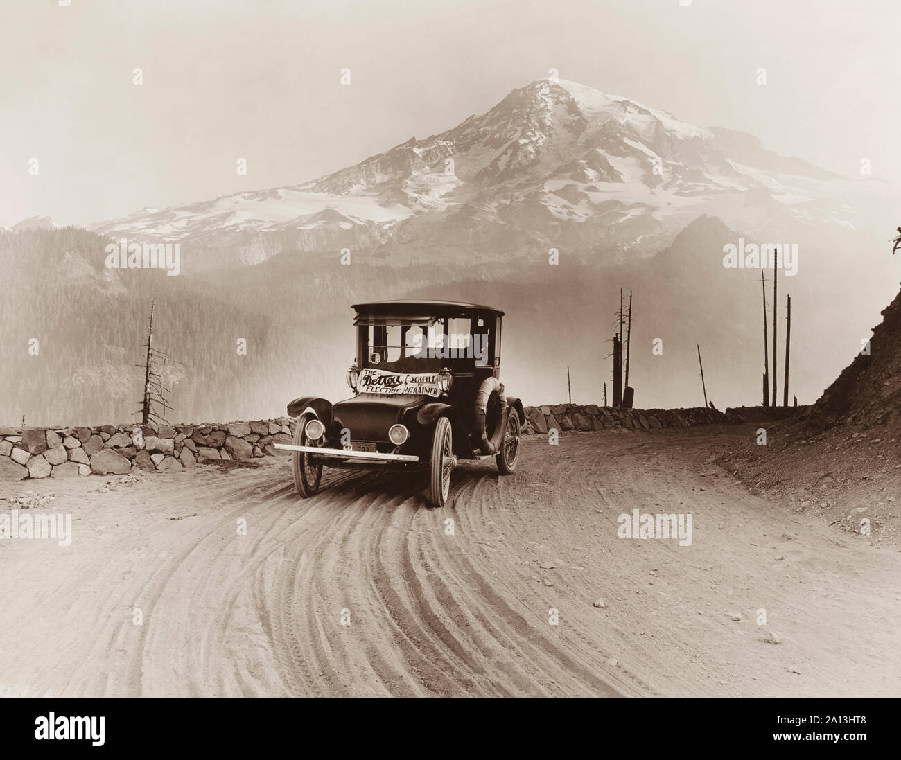 An electric car produced for on a promotional tour, with Mt. Rainier in the distance. Stock Photo