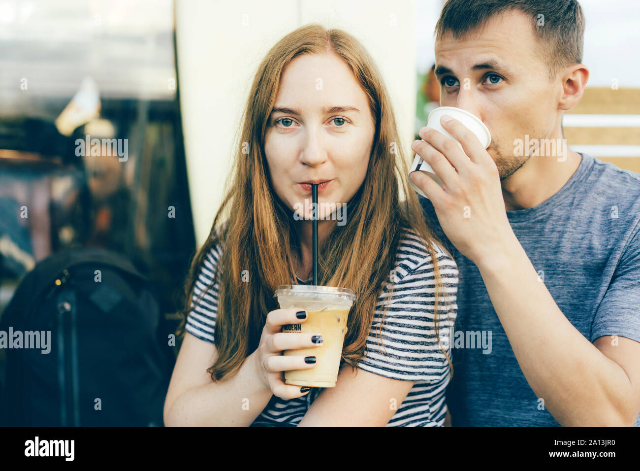 https://c8.alamy.com/comp/2A13JR0/girl-with-a-guy-drinking-coffee-from-a-straw-2A13JR0.jpg