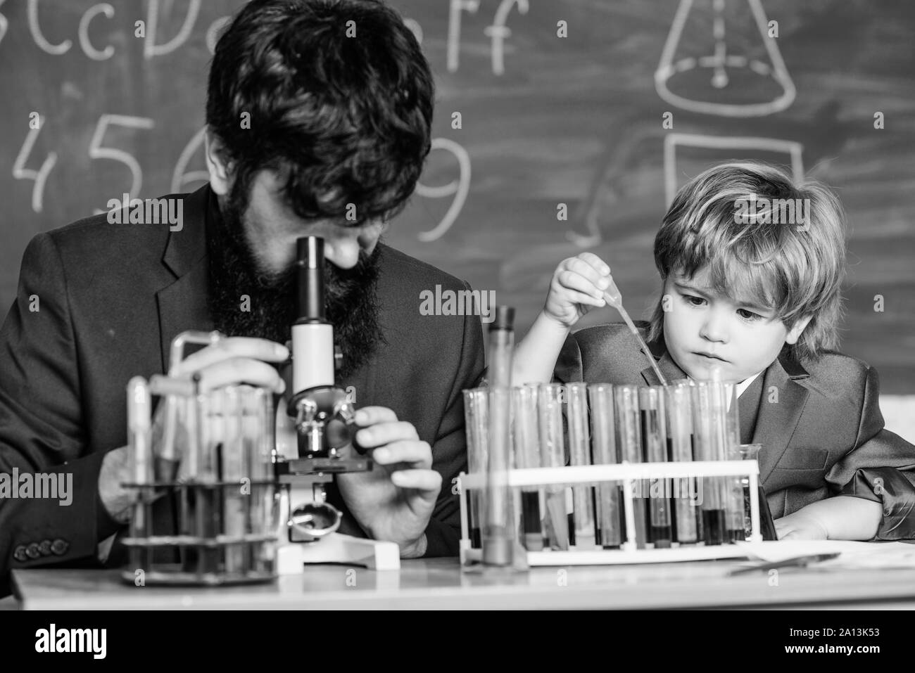 Back to school. student doing science experiments with microscope in