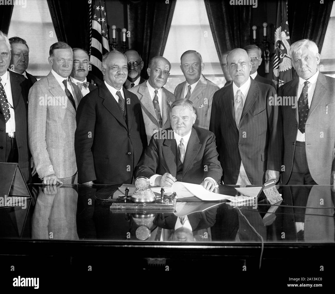 President Herbert Hoover signing the Farm-Relief Bill, 1929. Stock Photo
