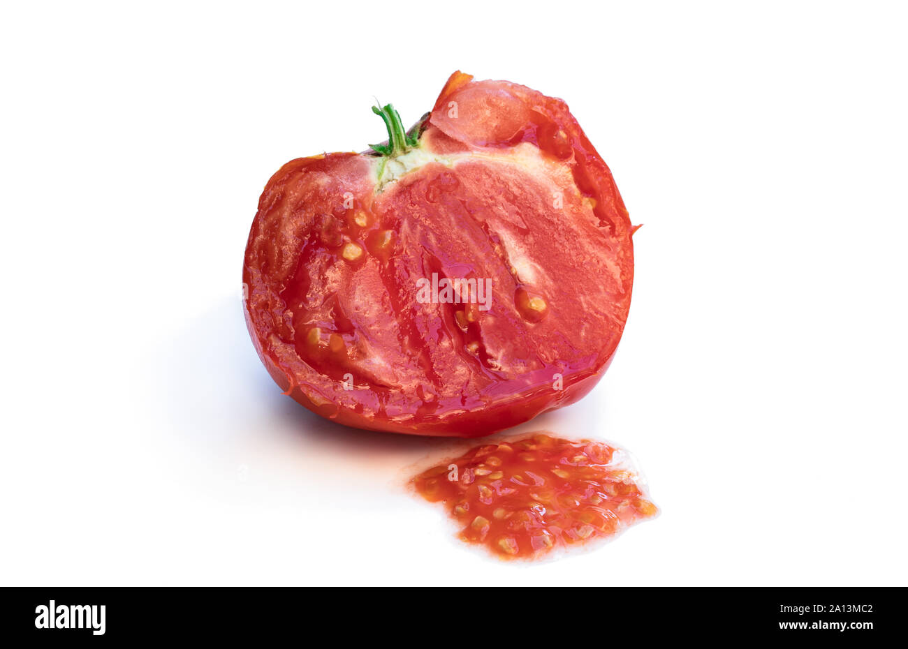 Process of manual tomato seeds extraction isolated on white Stock Photo