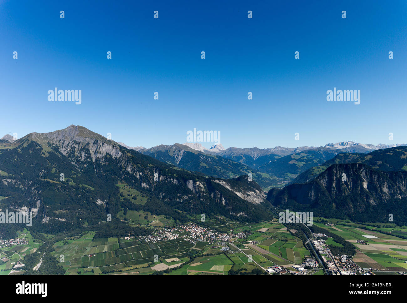 Horizontal view of a narrow thoroughfare gap in the mountains and valleys of the Swiss Alps Stock Photo
