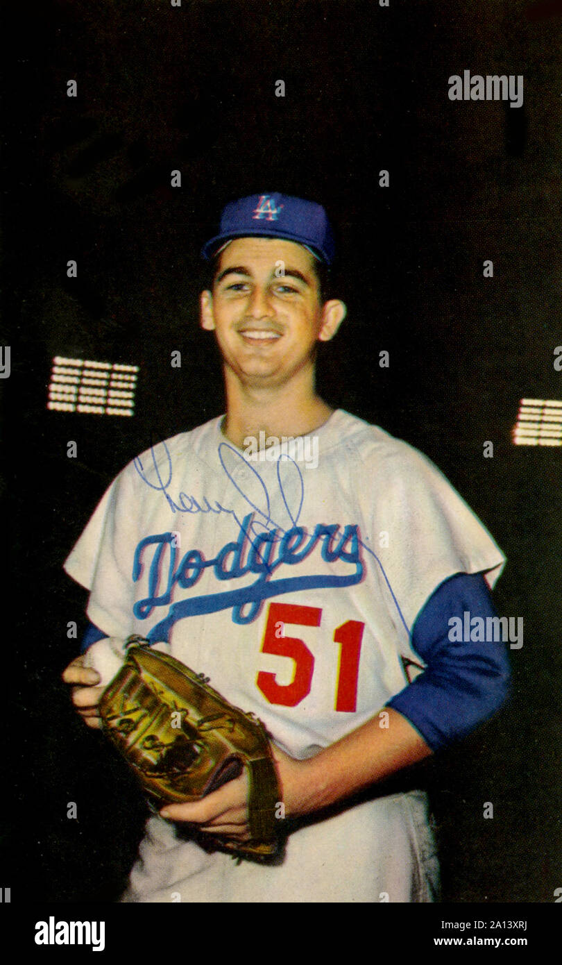 Vintage autographed color souvenir photo of Los Angeles Dodgers player Larry Sherry in the Memorial Coliseum circa 1959. Stock Photo