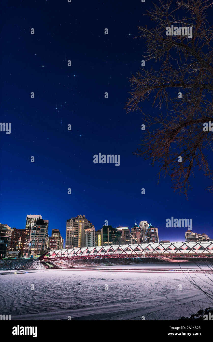 Orion on a clear night over the pedestrian Peace Bridge and Bow River in Calgary, Canada. Stock Photo