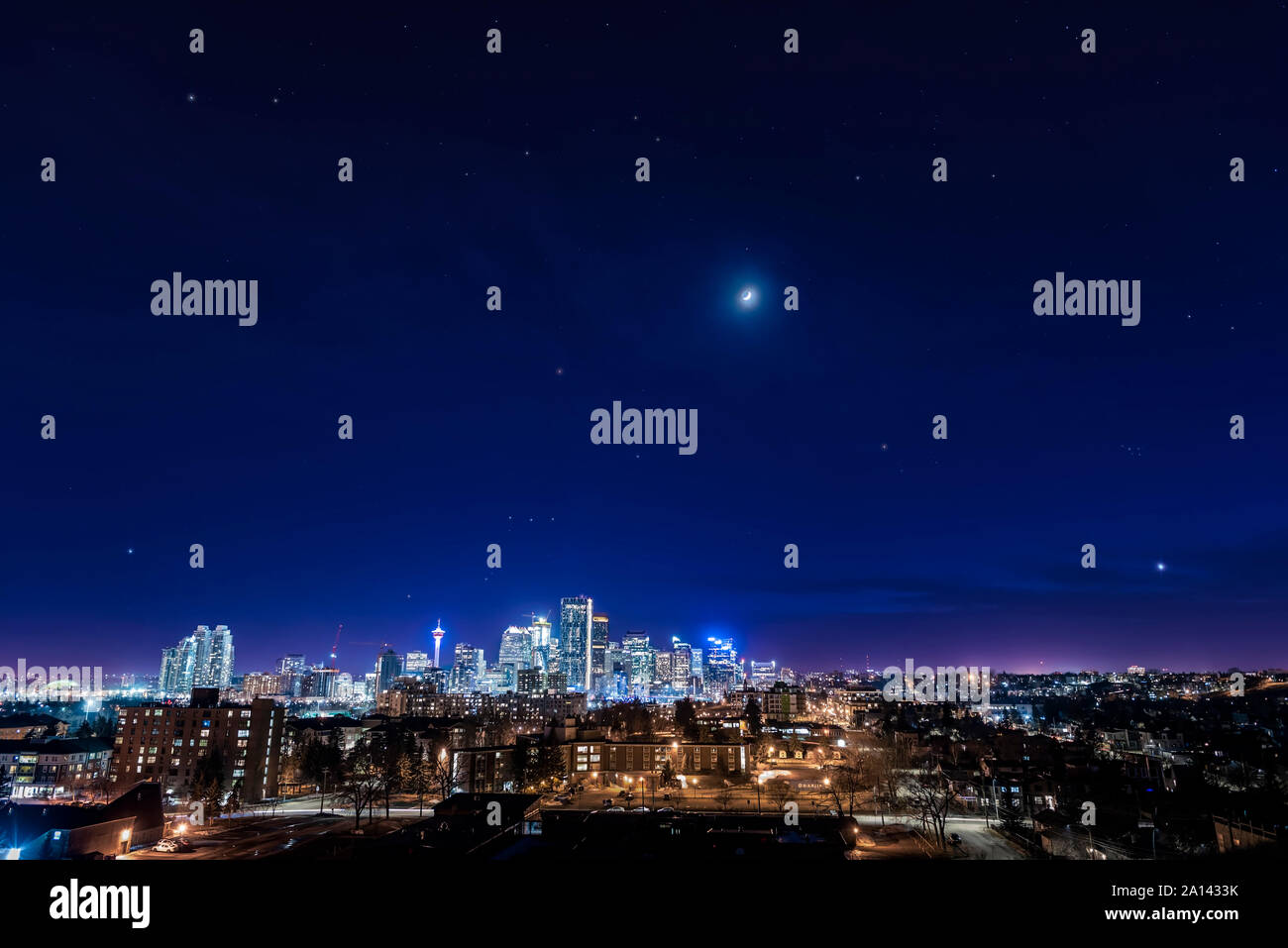 Orion and the stars of winter setting over the downtown core of Calgary, Canada. Stock Photo