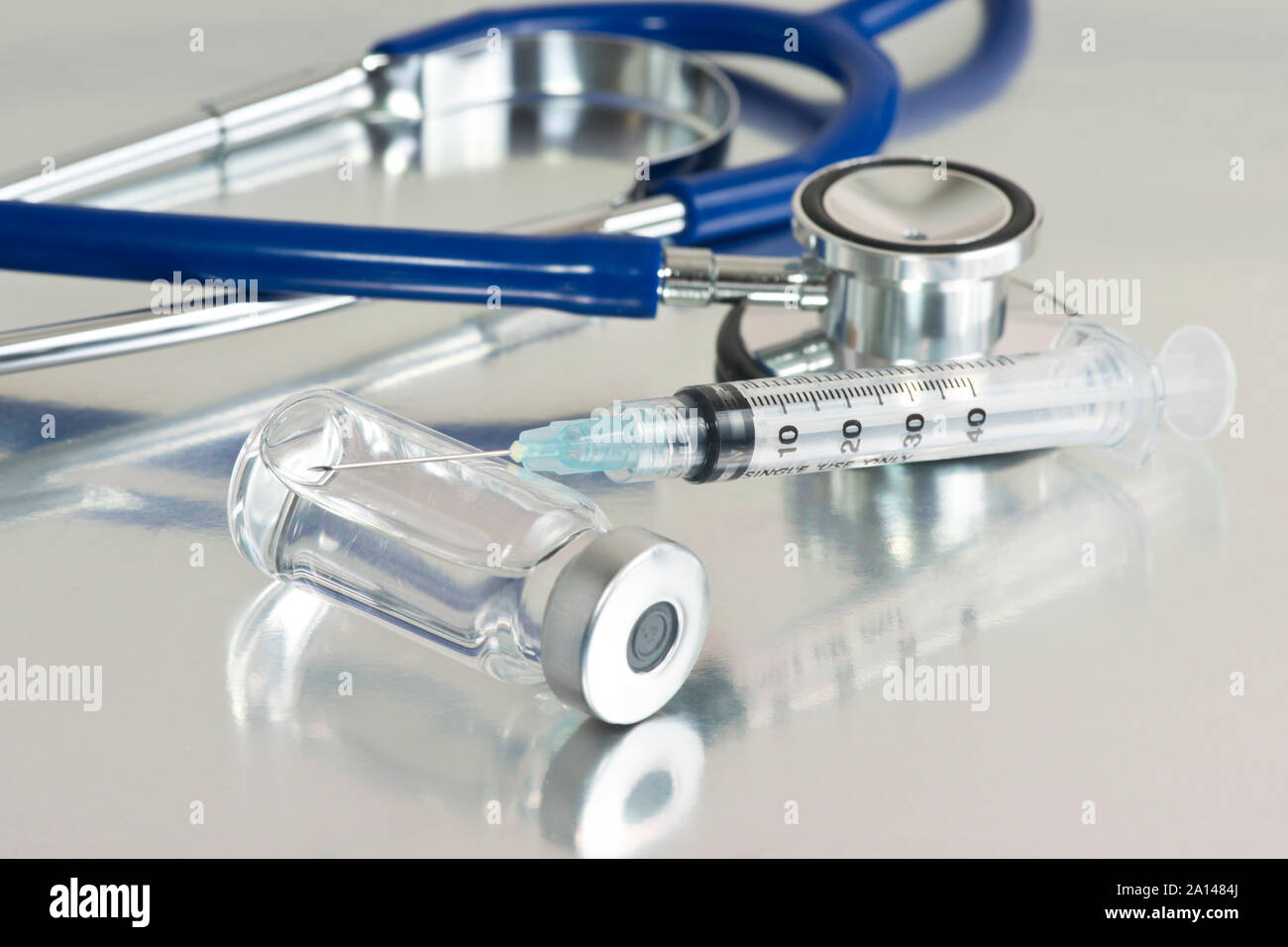 Close up of syringe and vial on metal tray with stethoscope Stock Photo ...