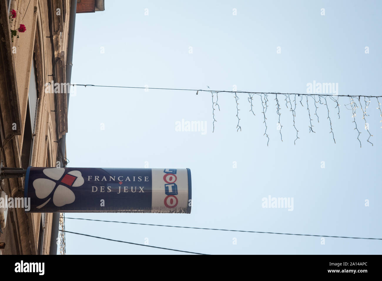 LYON, FRANCE - JULY 16, 2019: La Francaise des Jeux logo in front of their local retailer in Lyon. Also called FDJ, la Francaise des jeux is the gambl Stock Photo