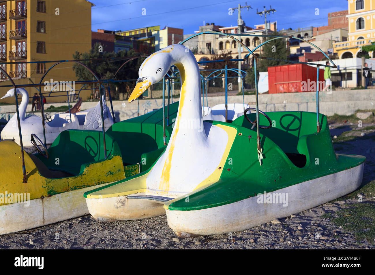 COPACABANA, BOLIVIA - OCTOBER 17, 2014: White and green swan shaped pedal boat on the shore of Lake Titicaca in Copacabana, Bolivia Stock Photo