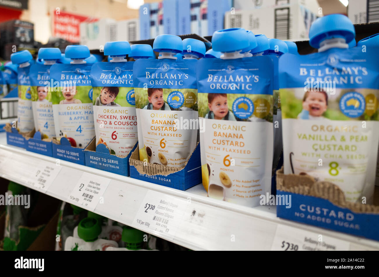 Bellamy's Organic baby food packages in different flavours on supermarket shelf. Stock Photo