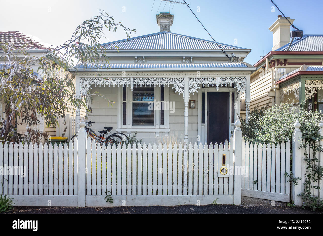 A typical Victorian era independent residential house in Australia. Facade of an Australian home with verandas sporting cast iron lacework. Stock Photo