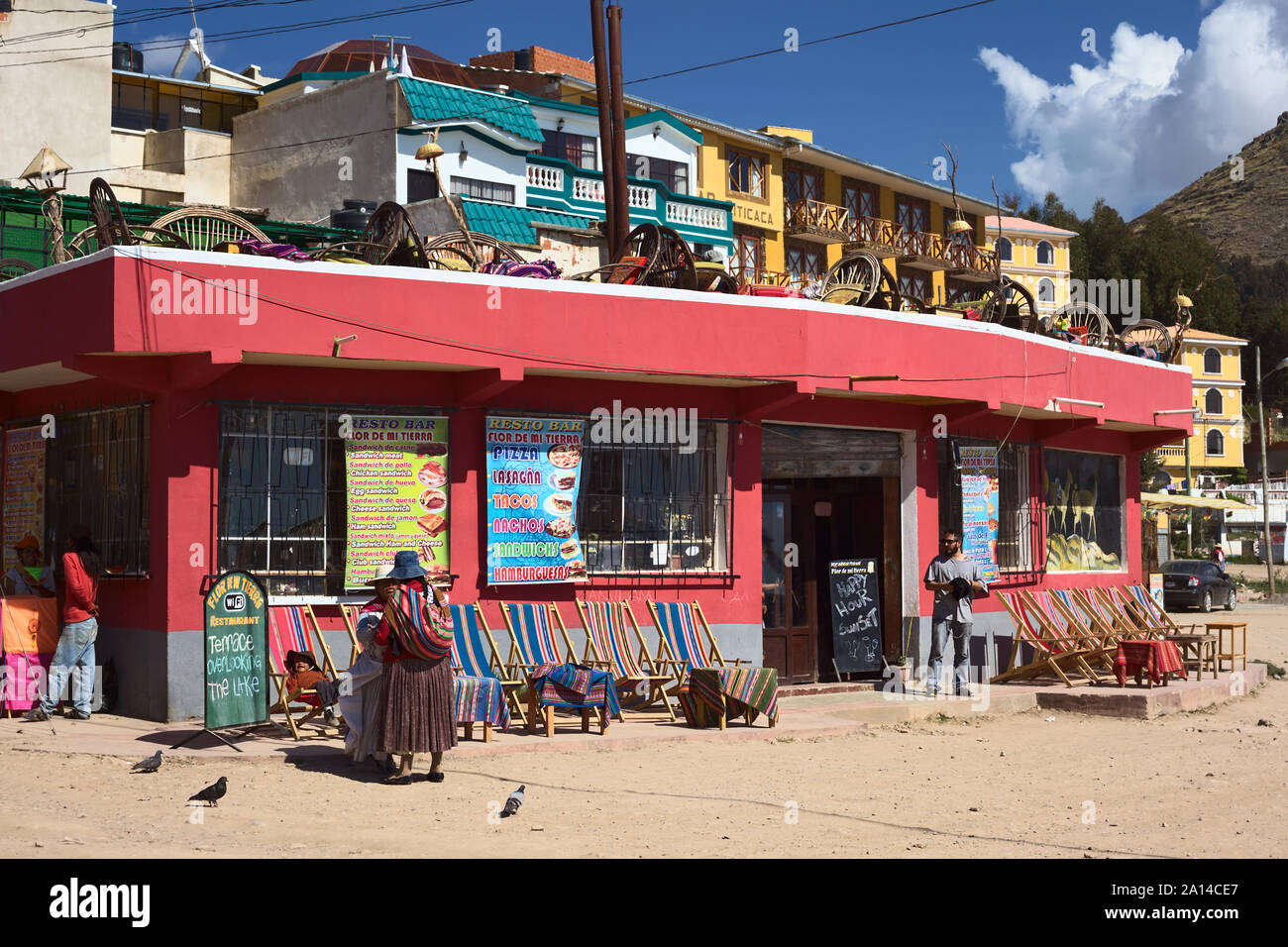 COPACABANA, BOLIVIA - OCTOBER 19, 2014: Unidentified people standing in front of the resto bar Flor de Mi Tierra in Copacabana, Bolivia Stock Photo