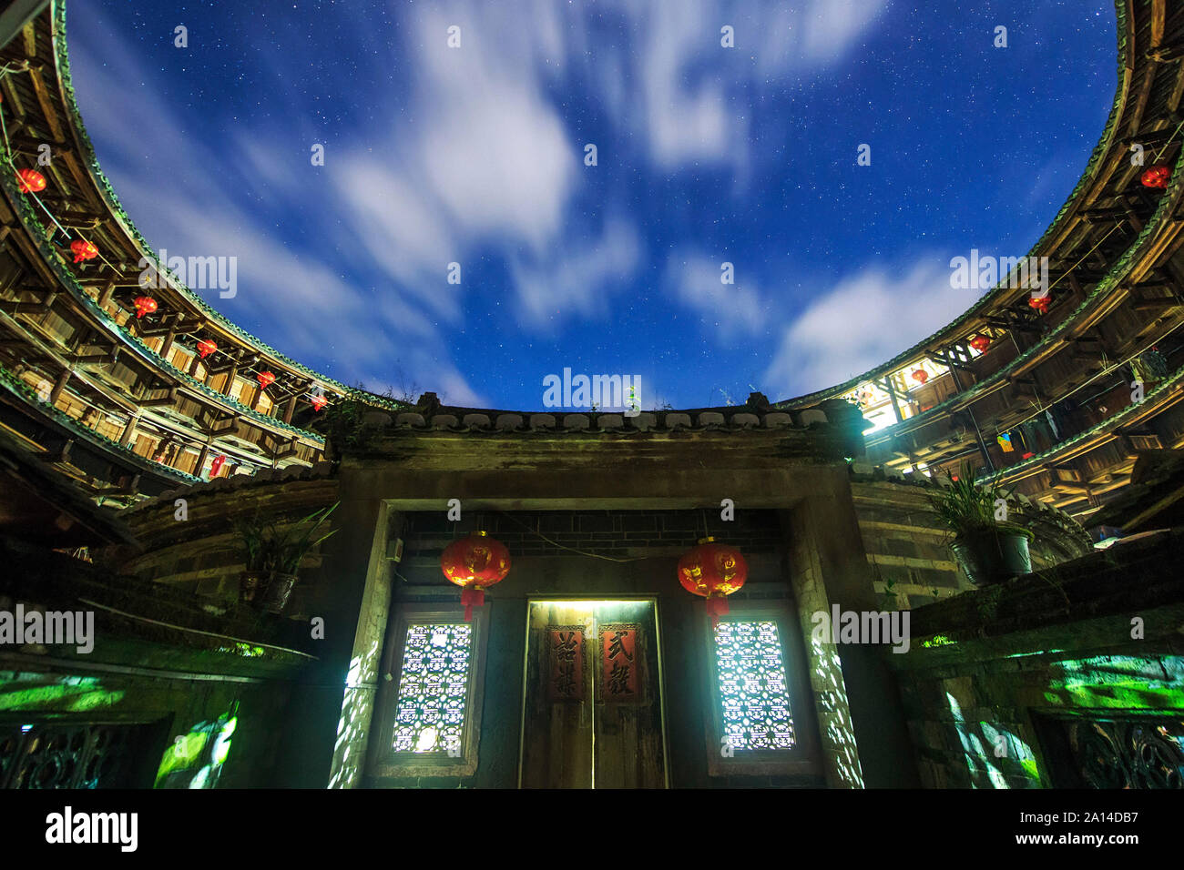 A cloudy night at Fujian tulou, a world heritage site in the Fujian province of China. Stock Photo