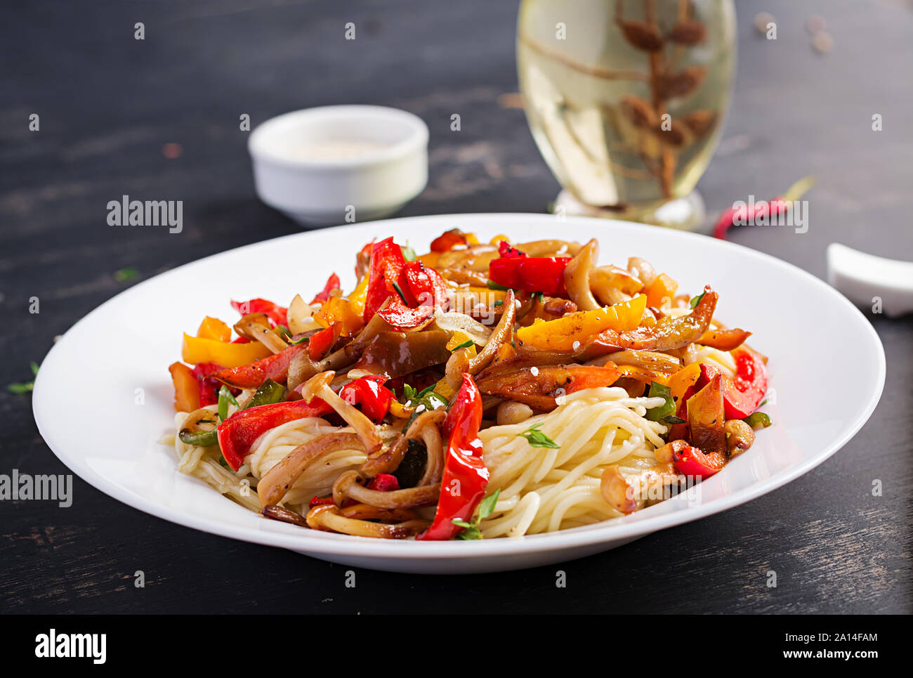Noodles with shimeji mushrooms and paprika. Oriental meal. Japanese