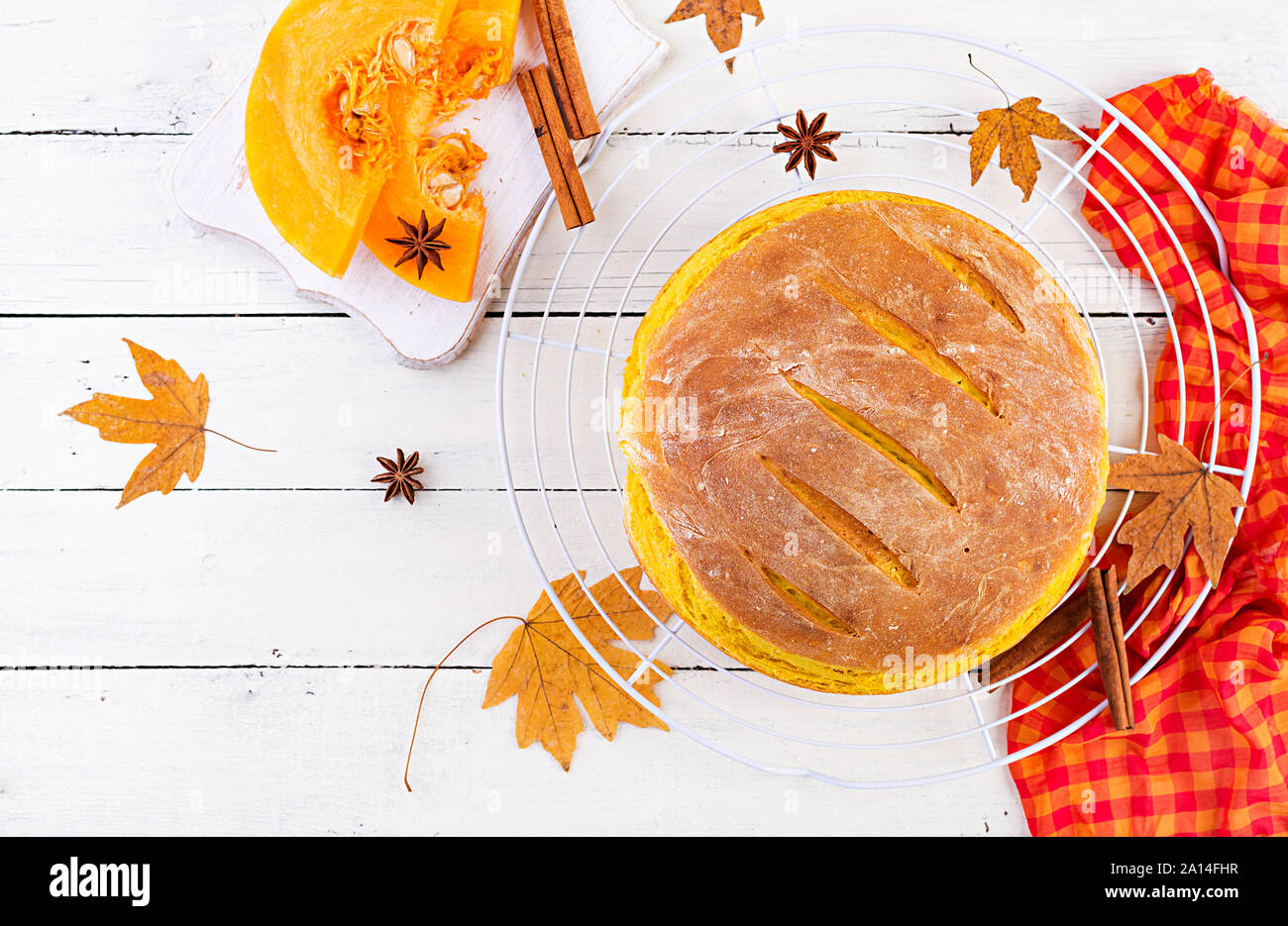 Fresh homemade pumpkin bread and pumpkin slices. Top view Stock Photo