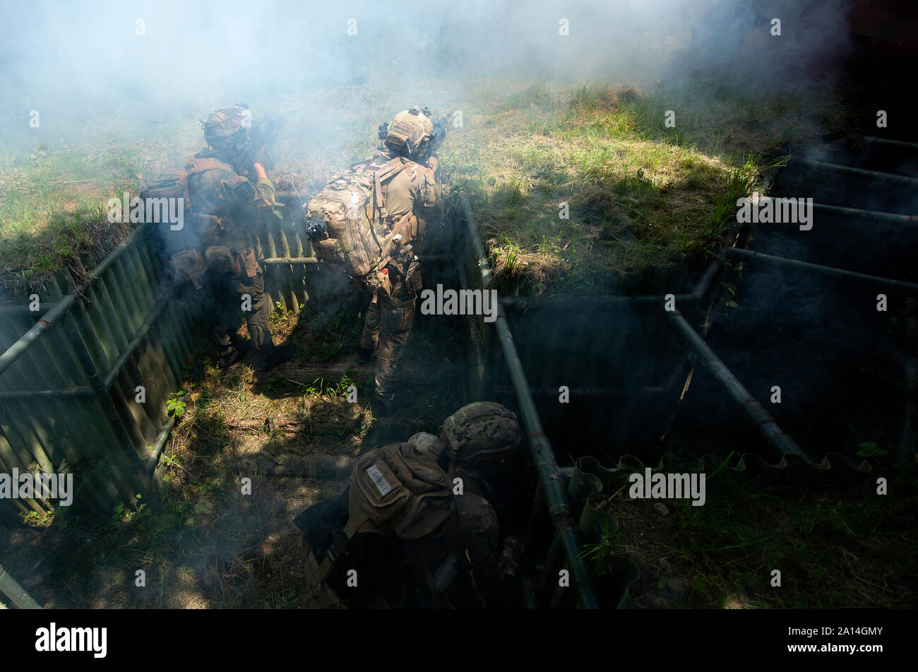 Norwegian and Italian Special Operations Forces come under fire as they evacuate casualties during the Advanced Casualty Sustainment Care course held at the International Special Training Centre in Pfullendorf, Germany, July 16, 2019. The three-week course included students from Belgium, Italy, Norway, the Netherlands, Luxembourg, Romania and U.S. is designed to provide students the foundation in tactical combat casualty care training to provide immediate medical care to a casualty in the very critical initial moments of injury. (U.S. Army photo by Rey Ramon) Stock Photo