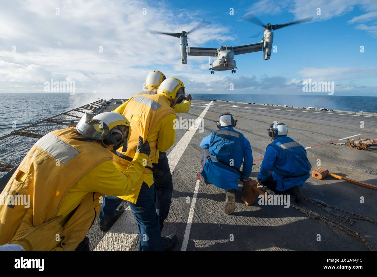 An MV-22 Osprey touches down on the flight deck aboard USS Fort McHenry. Stock Photo