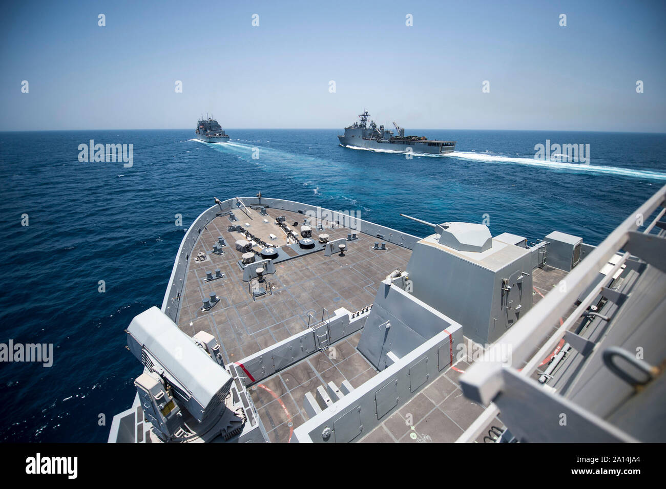 USS New York, USNS Charles Drew and USS Fort McHenry conduct a replenishment at sea. Stock Photo