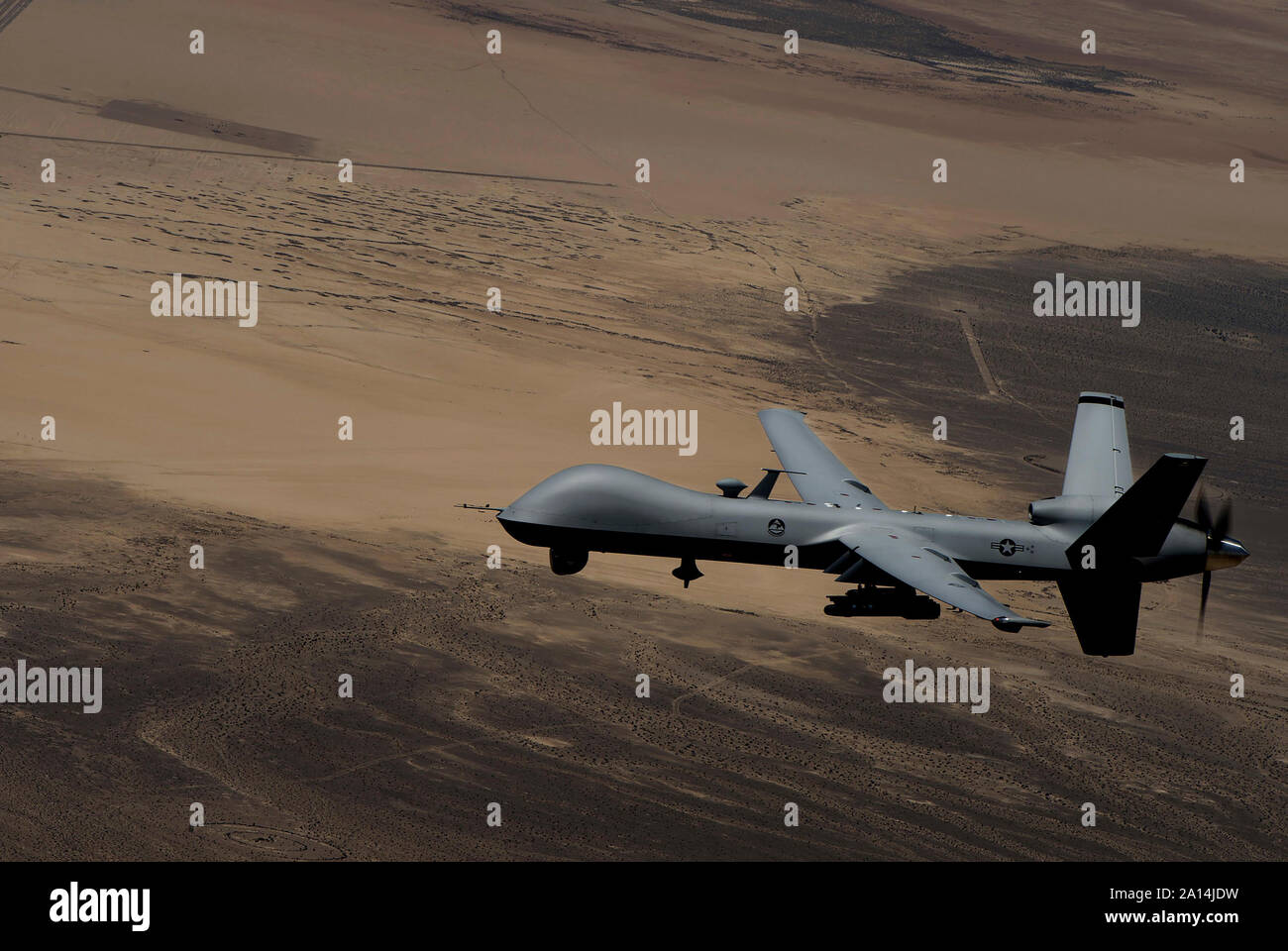 An umanned aerial vehicle conducts airdrop operations over Mount Sinjar, Iraq. Stock Photo