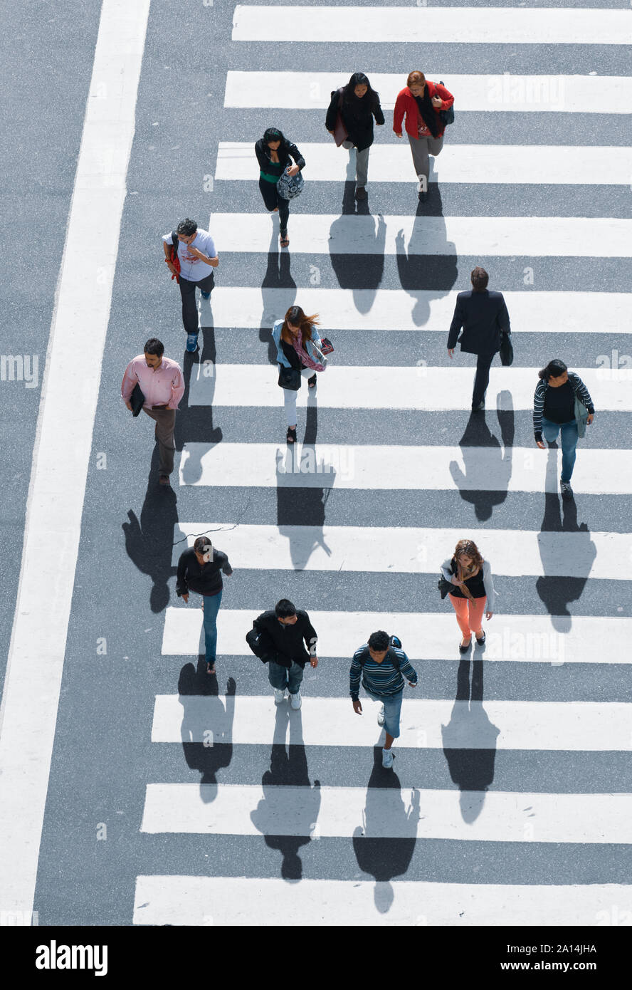 Buenos Aires, Argentina - November 13 2012: Pedestrians crossing the street over the zebra. Stock Photo