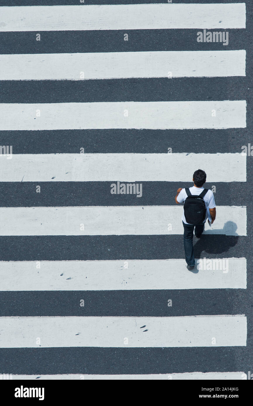 Buenos Aires, Argentina - November 12 2012: Pedestrian crossing the street over the zebra. Stock Photo
