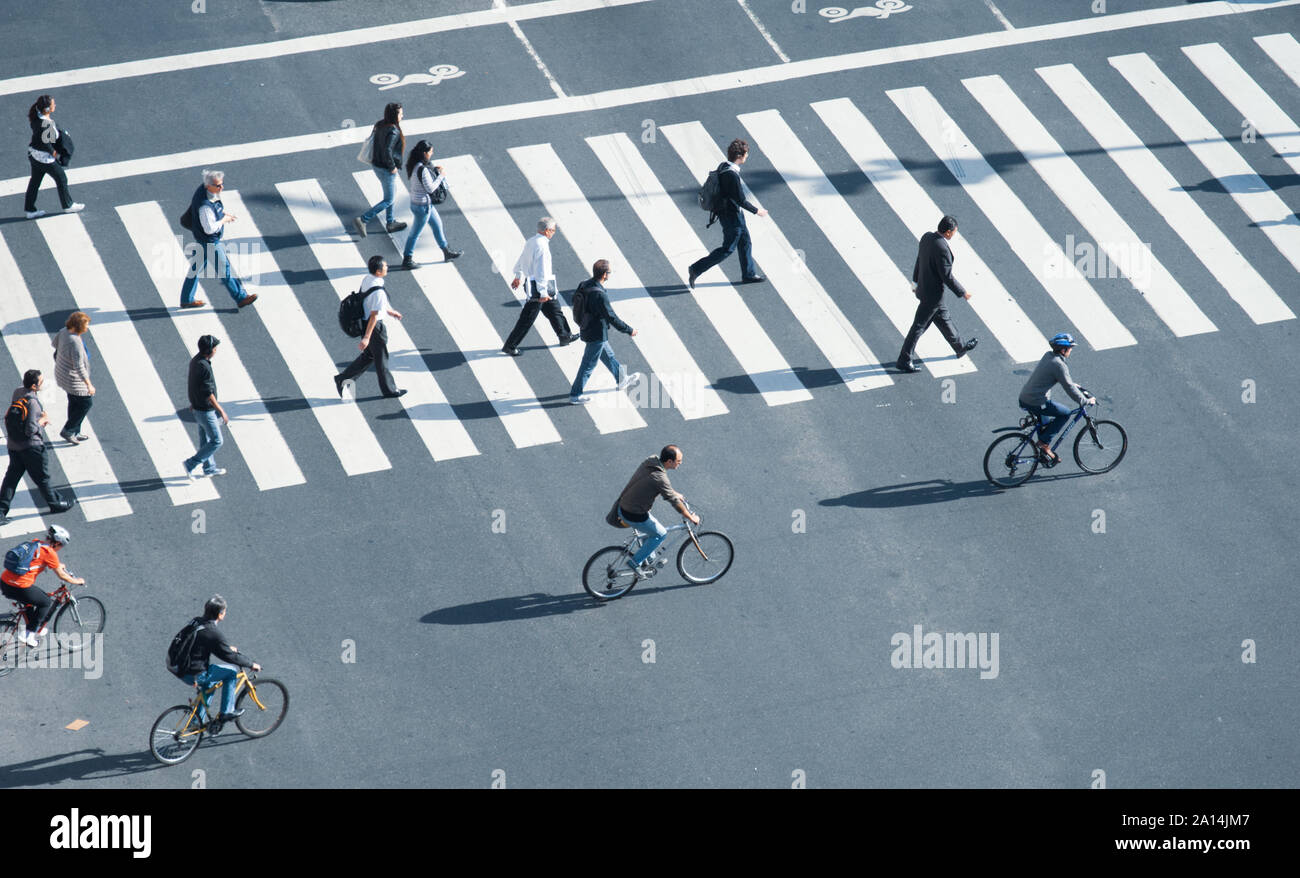 Buenos Aires, Argentina - November 12 2012: Pedestrians crossing the street over the zebra. Stock Photo