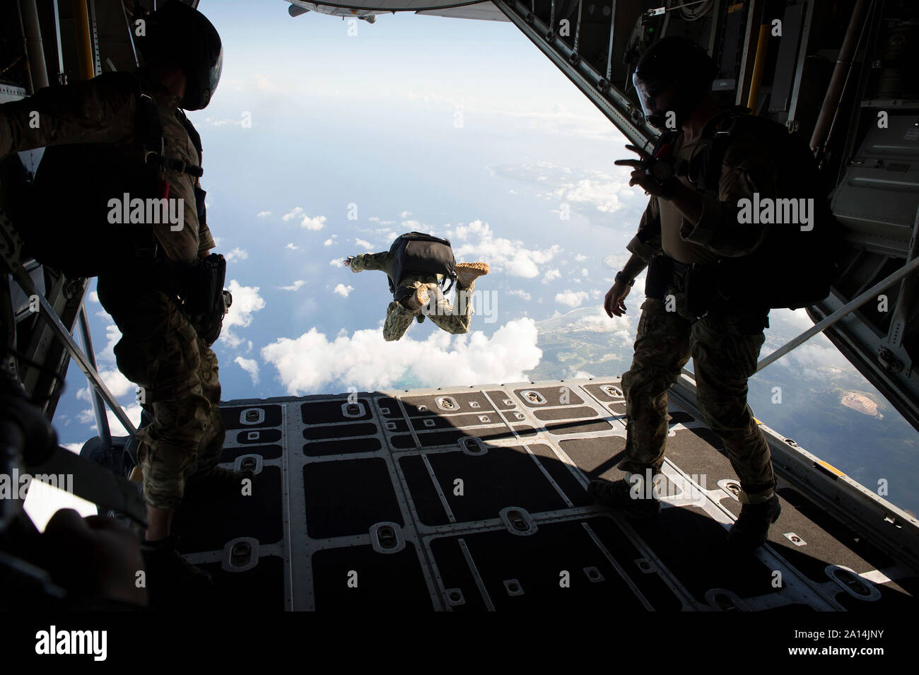 A free fall jump from a C-130 Hercules. Stock Photo