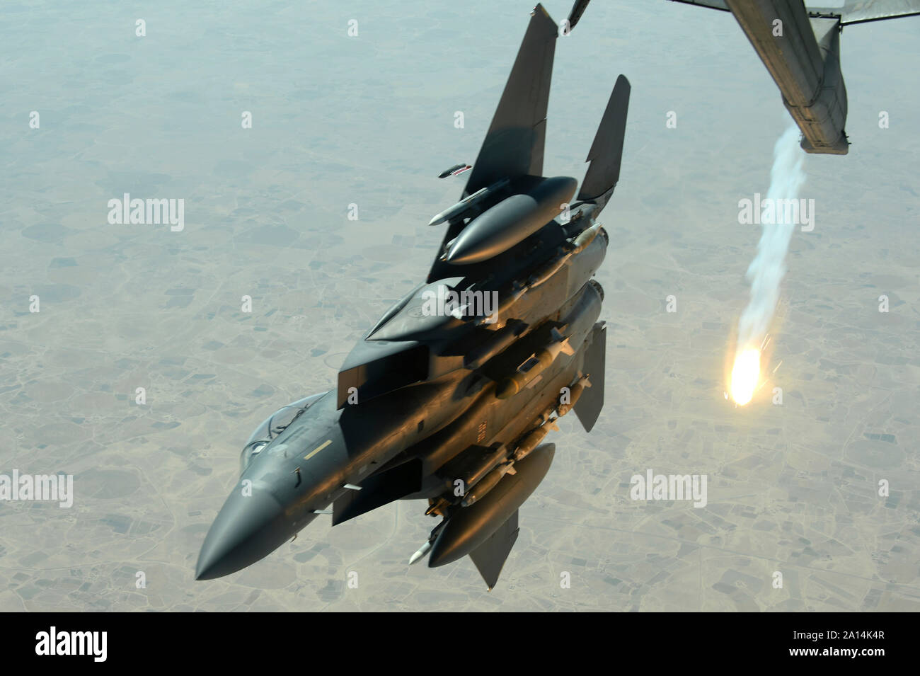 A U.S. Air Force F-15E Strike Eagle pops a flare. Stock Photo