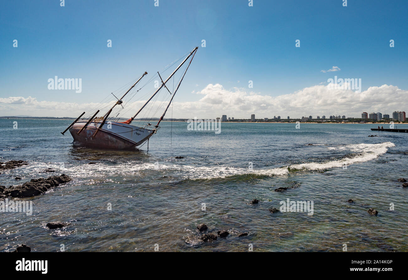 Punta del este, Uruguay - March 04 2016: A sailboat on the coast of Punta de Este in front of the center of the city. Stock Photo