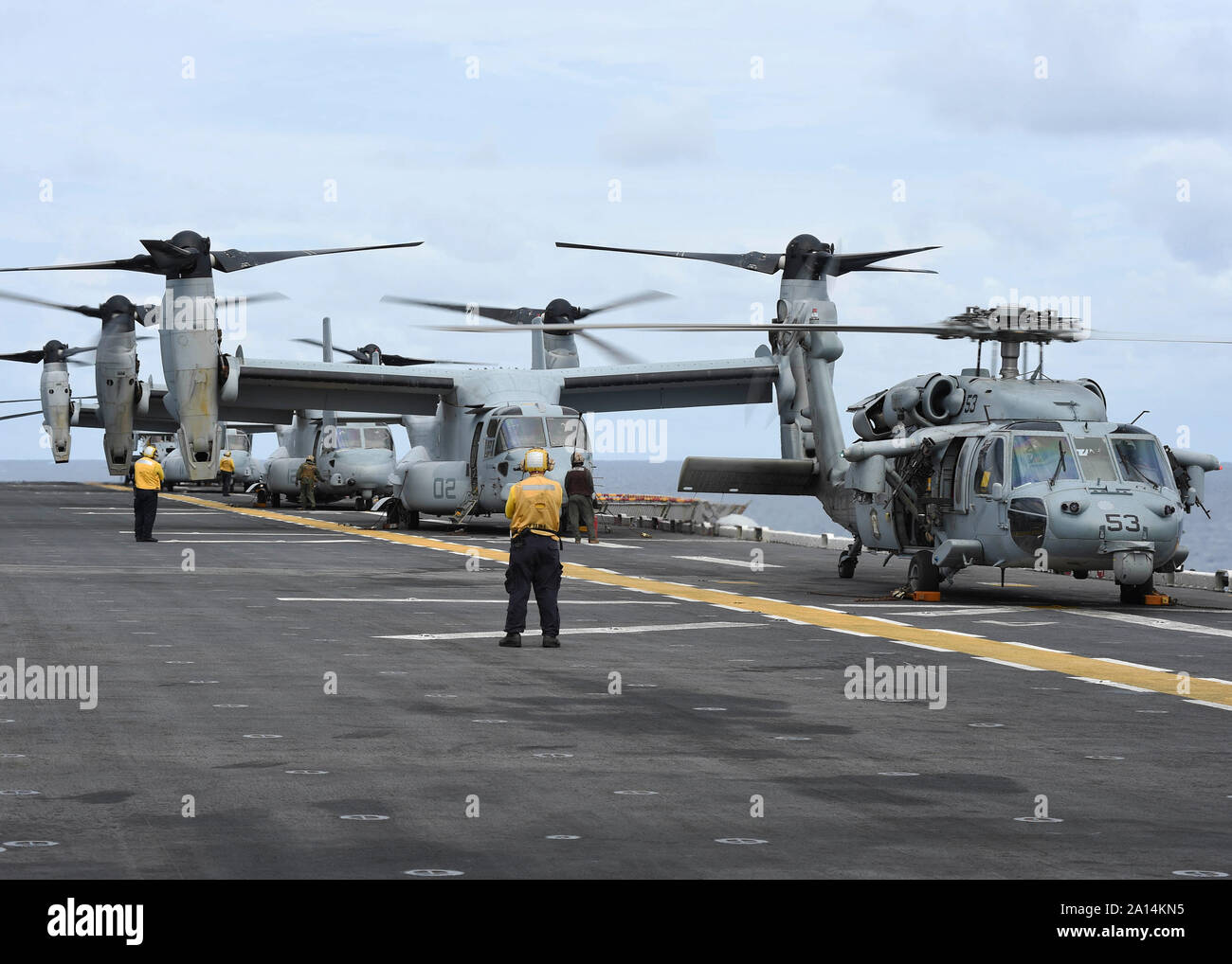 Aircraft are prepared to launch from the flight deck of amphibious assault ship USS Boxer. Stock Photo