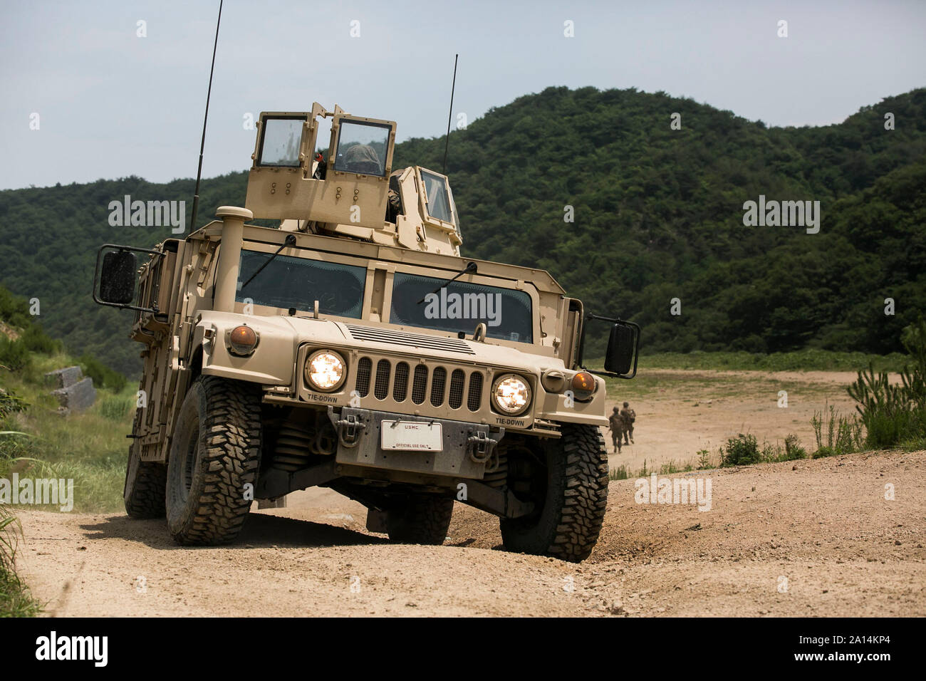 U.S. Marines drive a Humvee at the Sanseori Range in Pohang, Republic of Korea. Stock Photo