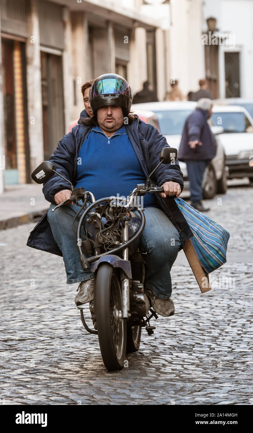 Buenos Aires, Argentina - Julio 02 2011: Streets of San Telmo a neighborhood of Buenos Aires city. A motorcycle that should not have a circulation per Stock Photo